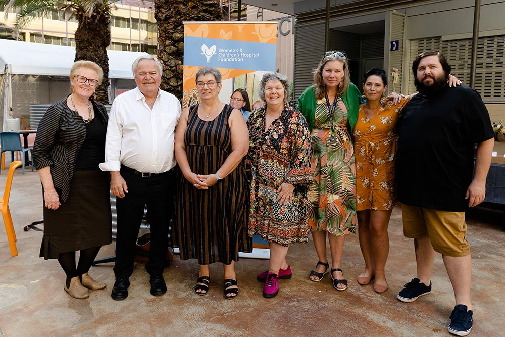 The launch of the Mirdilyayanthi window mural. Left to right: Jane Scotcher (CEO WCH Foundation), Phil Robinson (WCHN Executive Director, Corporate Services), Cathy Leanne (Manager, Aboriginal Strategic Partnerships Aboriginal Health Division), Samantha Yates (Art Gallery of South Australia Producer of Tarnanthi), Nici Cumpston OAM (Art Gallery of South Australia Director of Tarnanthi), artist Elizabeth Close and writer Dominic Guerrera.