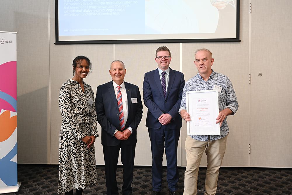 Dr Najma Moumin, Michael Luchich, the Honourable Chris Picton MP and Professor Tim Green at the 2023 Bloom Research Program awards night.